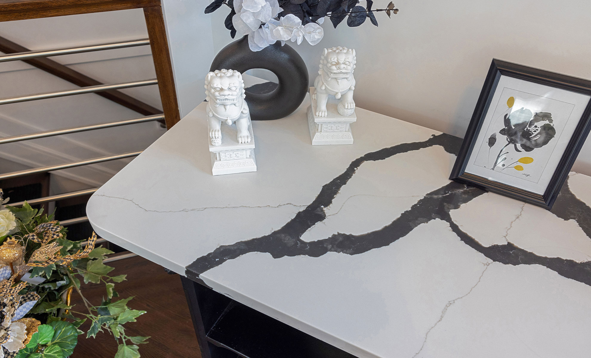 This image depicts a bookcase featuring thick quartz veining in bold gray and white tones, creating a striking focal point. 